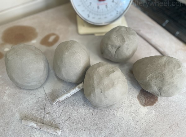 prepare balls of pottery clay
