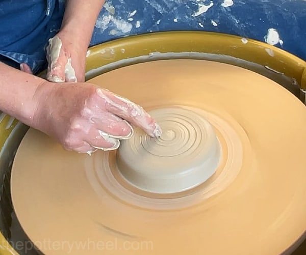 Finding the center of your clay with your finger