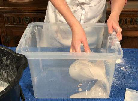 Pouring plaster into the damp box