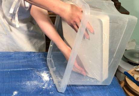 Removing the plaster from the damp box for clay