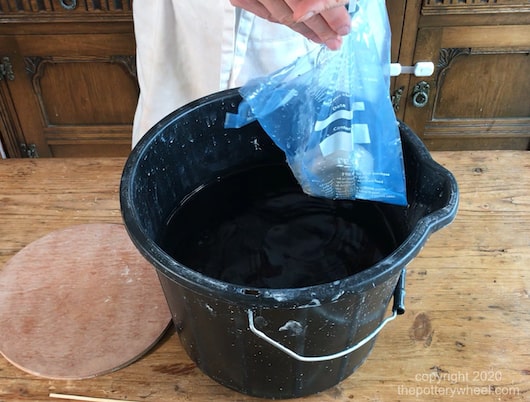 Rehydrating clay in a bucket