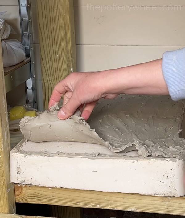 Rehydrating dry clay on a plaster slab