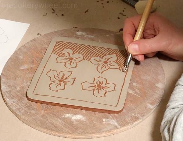 Sgraffito on leather hard clay