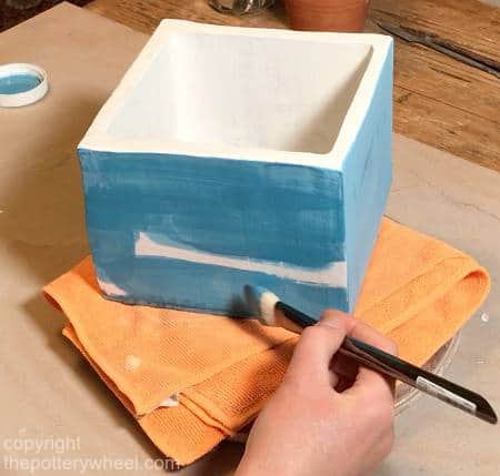 applying underglaze to sgraffito pottery