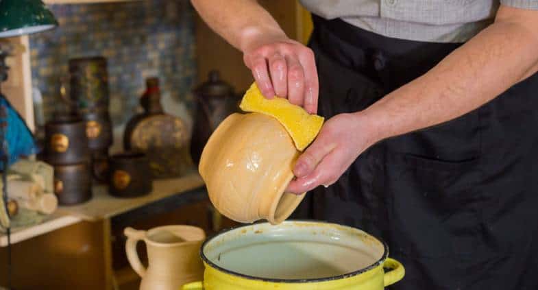 can you wash glaze off bisque pottery