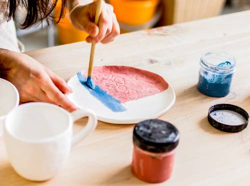 painting with glaze on pottery