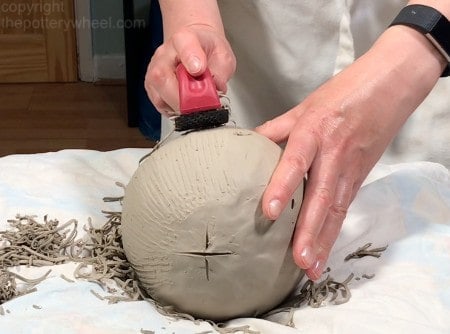 using a shredder on the clay sphere