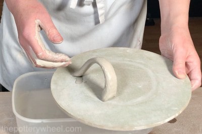 a handle for a double pinch pot
