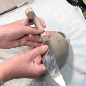 attaching a handle to a double pinch pot