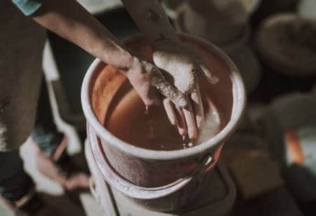 washing hands in home pottery studio