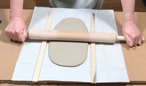 rolling clay on table cloth