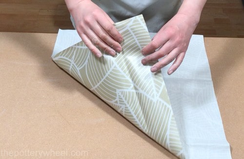 rolling clay on fabric backed table cloth