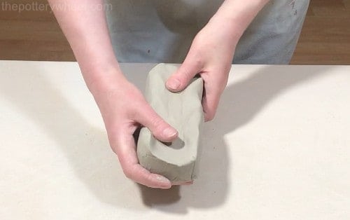 shaping the clay before rolling the slab