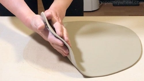 lifting a soft slab of clay
