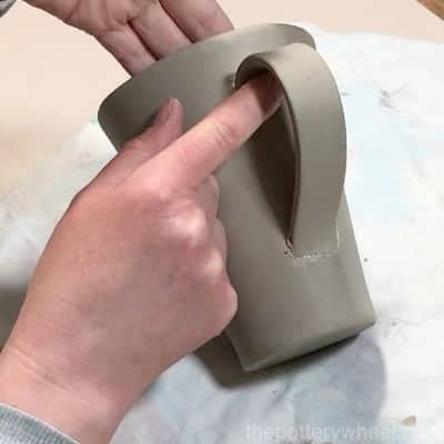 Adding the handle to the mug
