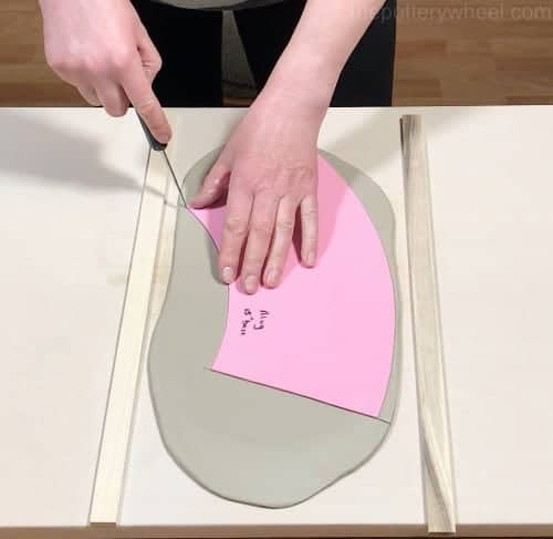 cutting the clay with a template