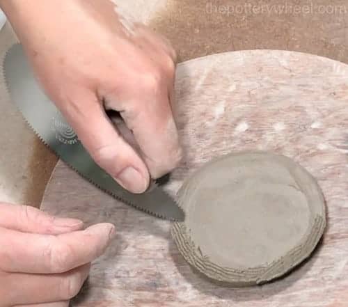 scoring the base of the pot