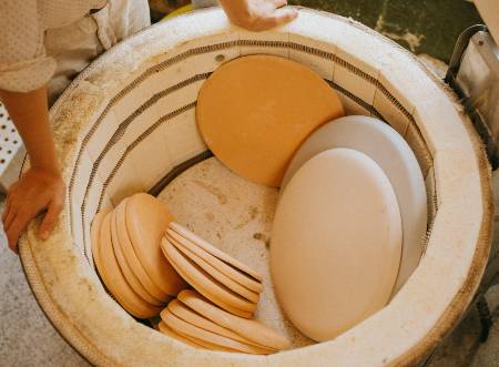 pottery stacked in kiln