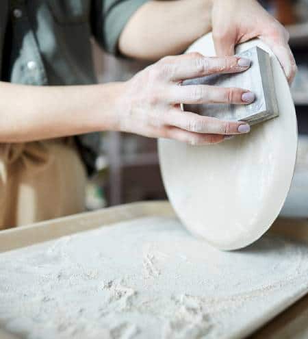 Sanding greenware pottery