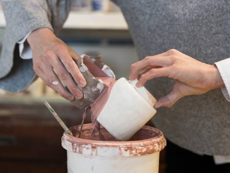 pottery being glazed