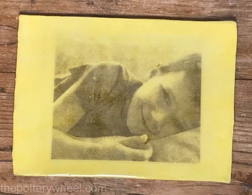 transfer image onto clay colored with yellow slip