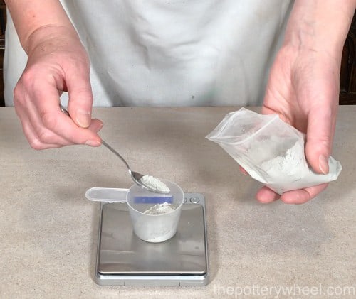 weighing bentonite clay to add to glaze