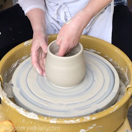 Making pottery on a wheel