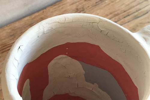 glaze not sticking to bisque pottery