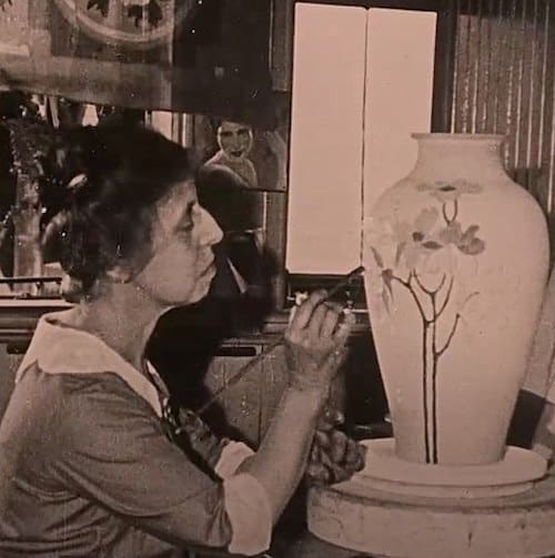 Sara Sax painting a vase