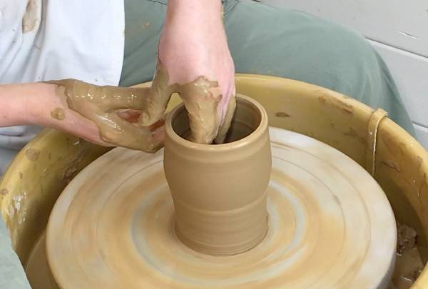 Throwing the wild clay on the wheel
