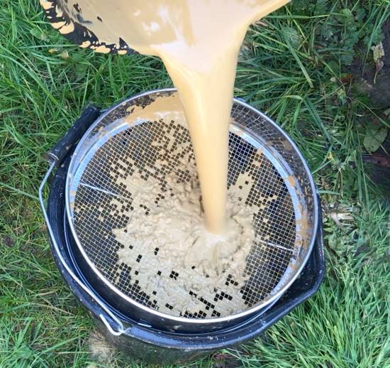 sieving the clay liquid with a smaller mesh