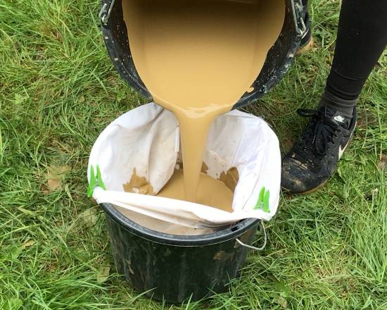 pouring clay slip into a pillow case