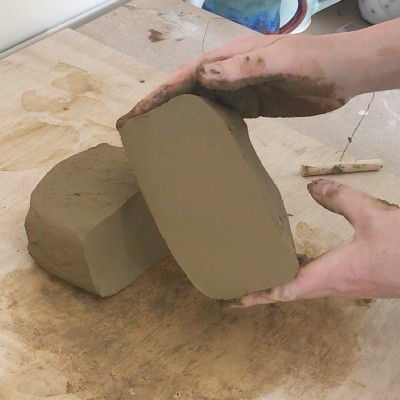 slicing clay into two