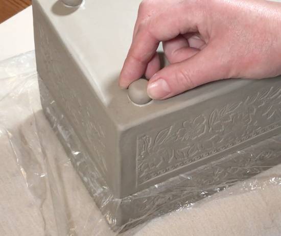 Adding the feet to the ceramic slab box