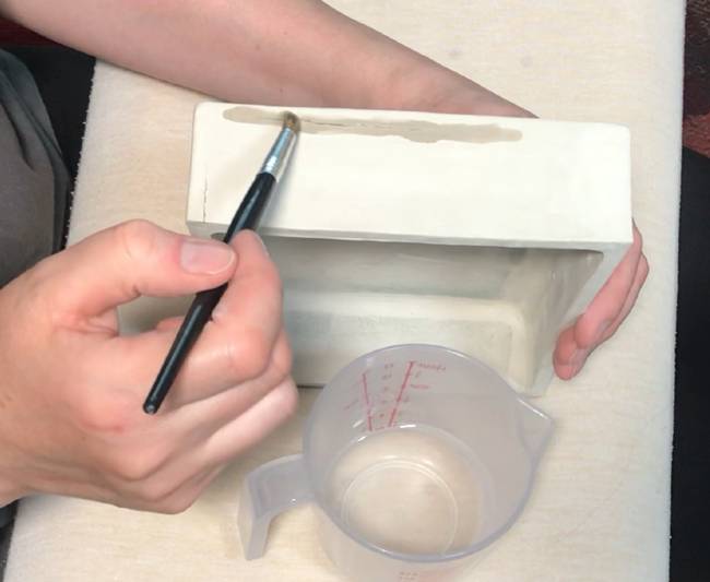 applying vinegar to cracked bone dry clay