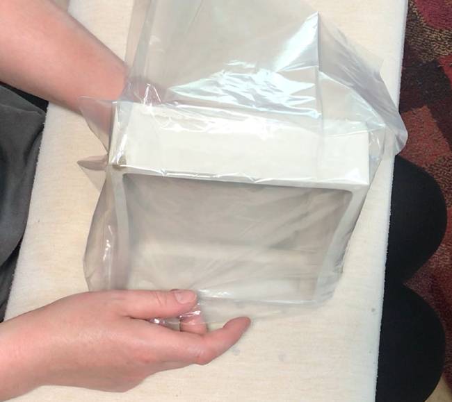 putting the clay into a plastic bag