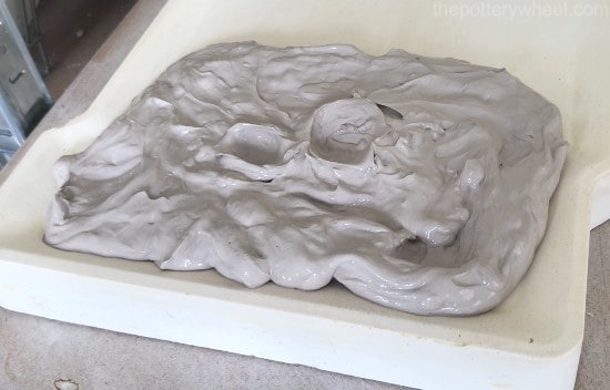 Rehydrated clay slurry on a plaster slab