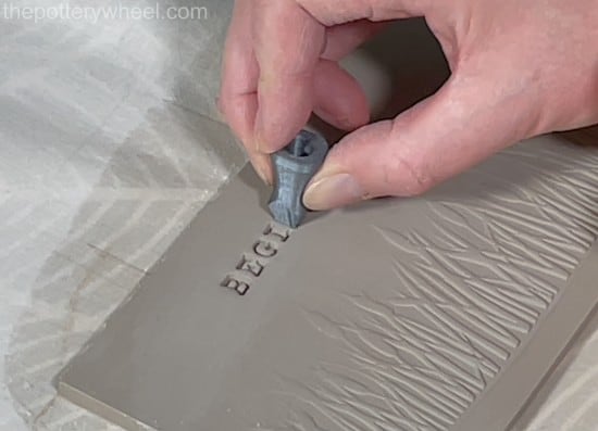 Decorating clay with lettering
