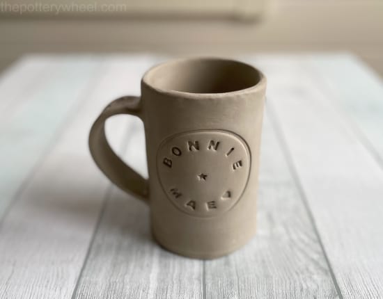 Mug with stamped with letters