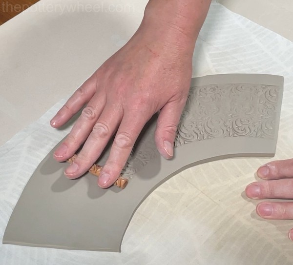 Adding texture to clay vase slabs