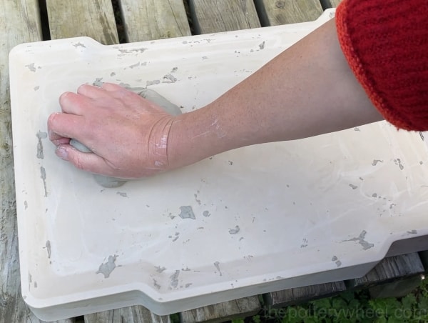 Cleaning up the plaster slab for drying clay