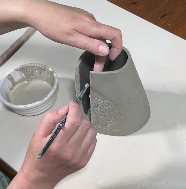 joining the seam on the clay vase slab
