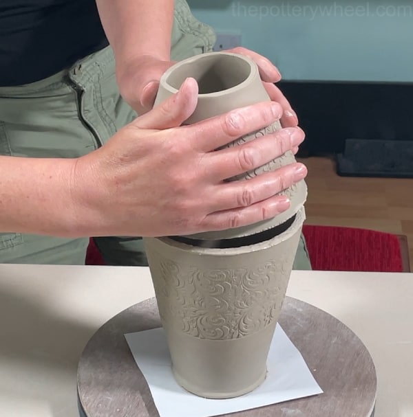 joining the two halves of clay vase