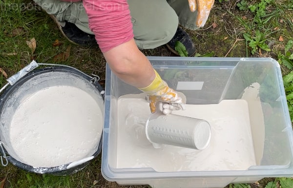 pouring plaster in the container