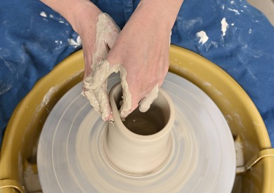 Stoneware clay on the pottery wheel