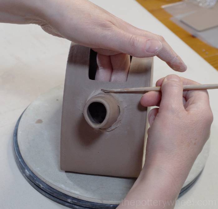 Blending on the spout onto the slab pottery teapot