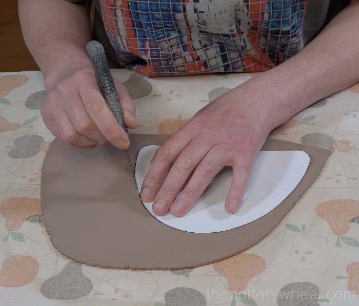 Cutting out the side of the slab pottery teapot