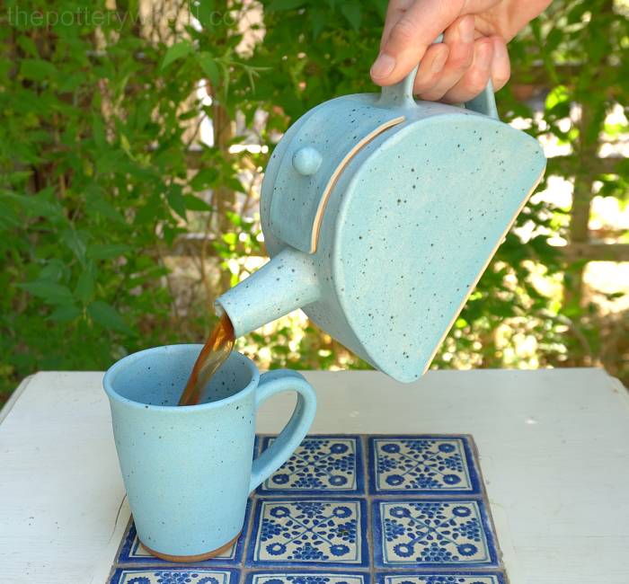 Slab pottery teapot pouring tea