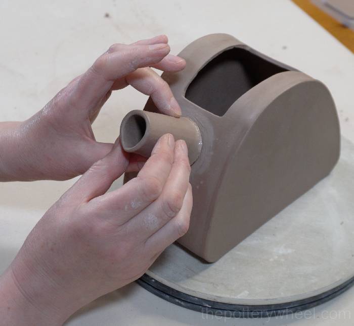 positioning the spout on the slab pottery teapot