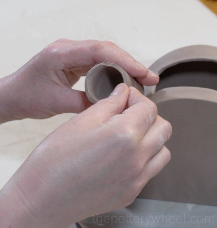 shaping the spout of the slab pottery teapot